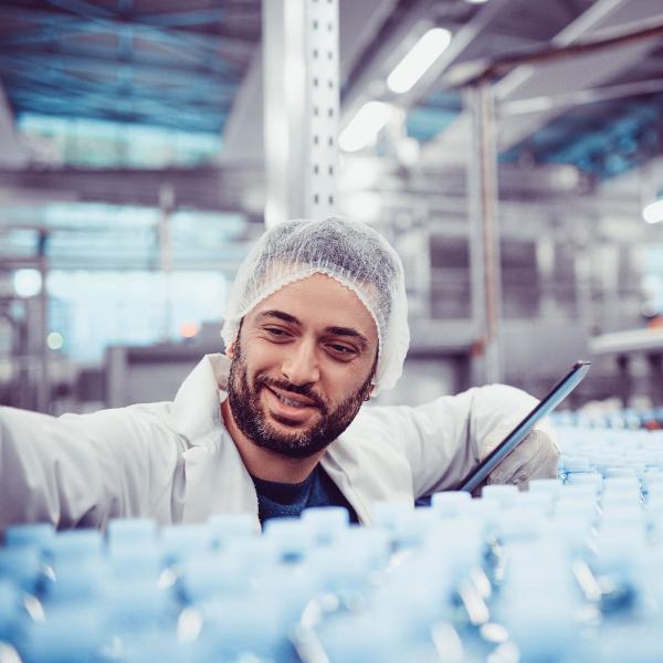 Employee looking at production line in Lifestyle nutrition factory