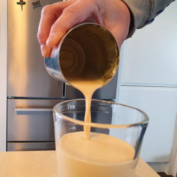 image of milk being poured into a coffee