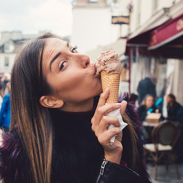 image of a woman eating an ice cream