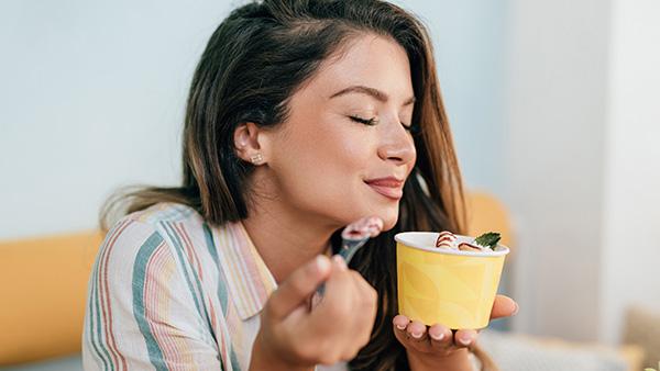 girl enjoying yoghurt
