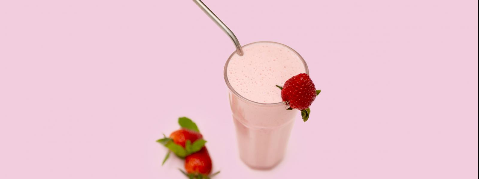 Strawberry Protein Beverage in glass with straw
